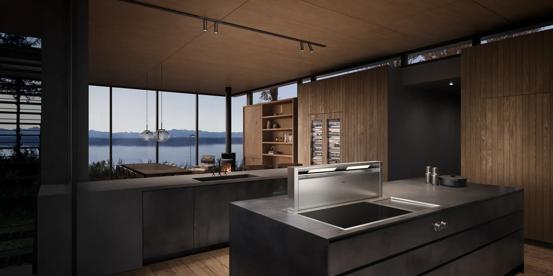 Thiết kế bếp mở biệt thự với đảo bếp Gaggenau nối liền phòng khách và khung kính nhìn ra hồ Thiết kế bếp mở biệt thự với đảo bếp Gaggenau nối liền phòng khách và khung kính nhìn ra hồ
